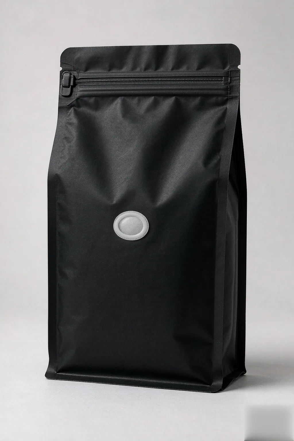 Matte black coffee stand-up pouch with ultrasonic-welded one-way degassing valve and dual-track resealable zipper by RainRan Packaging